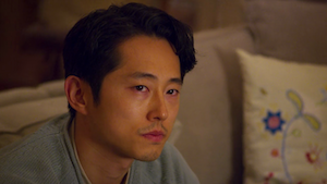 an asian man looking forlorn after using too small a square